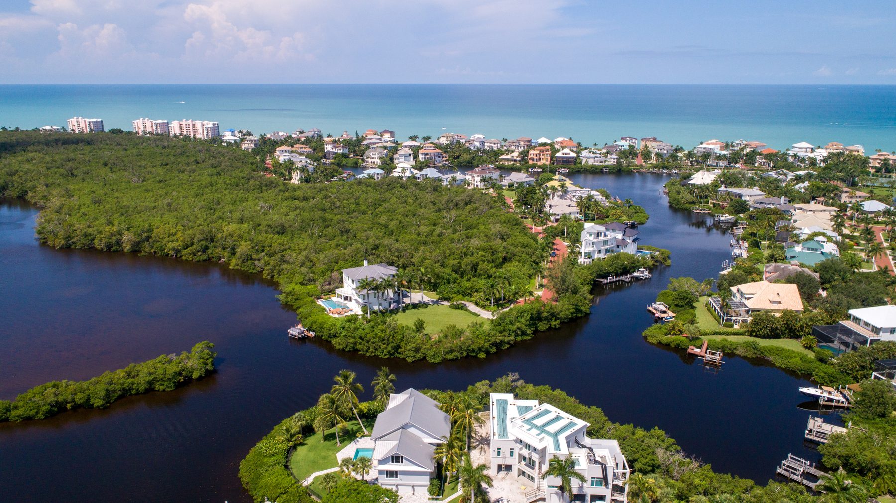 Aerial view of Bonita Beach with the Imperial River and Gulf-front homes