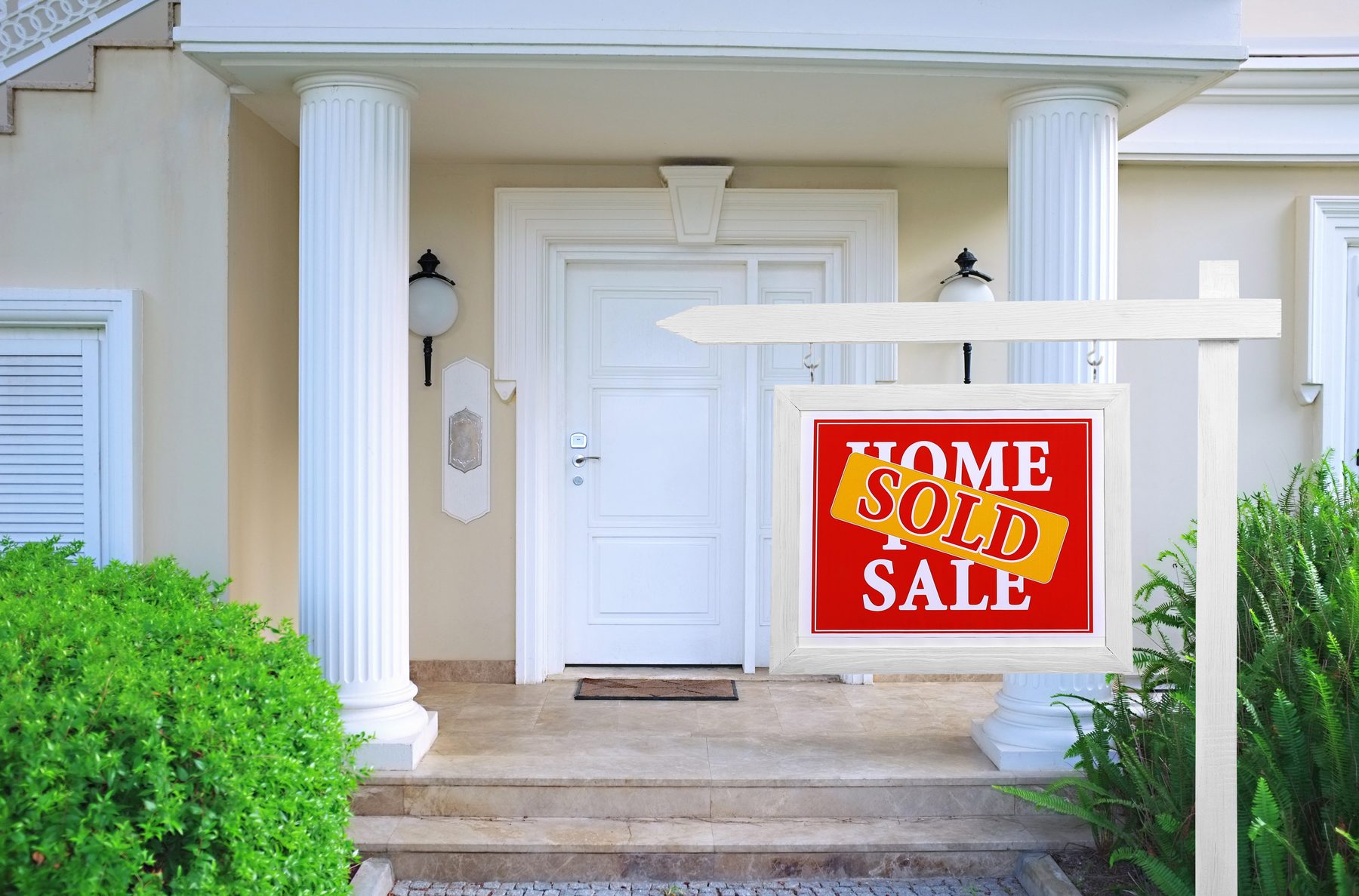 Home for sale sign reading Sold outside a Southwest Florida house